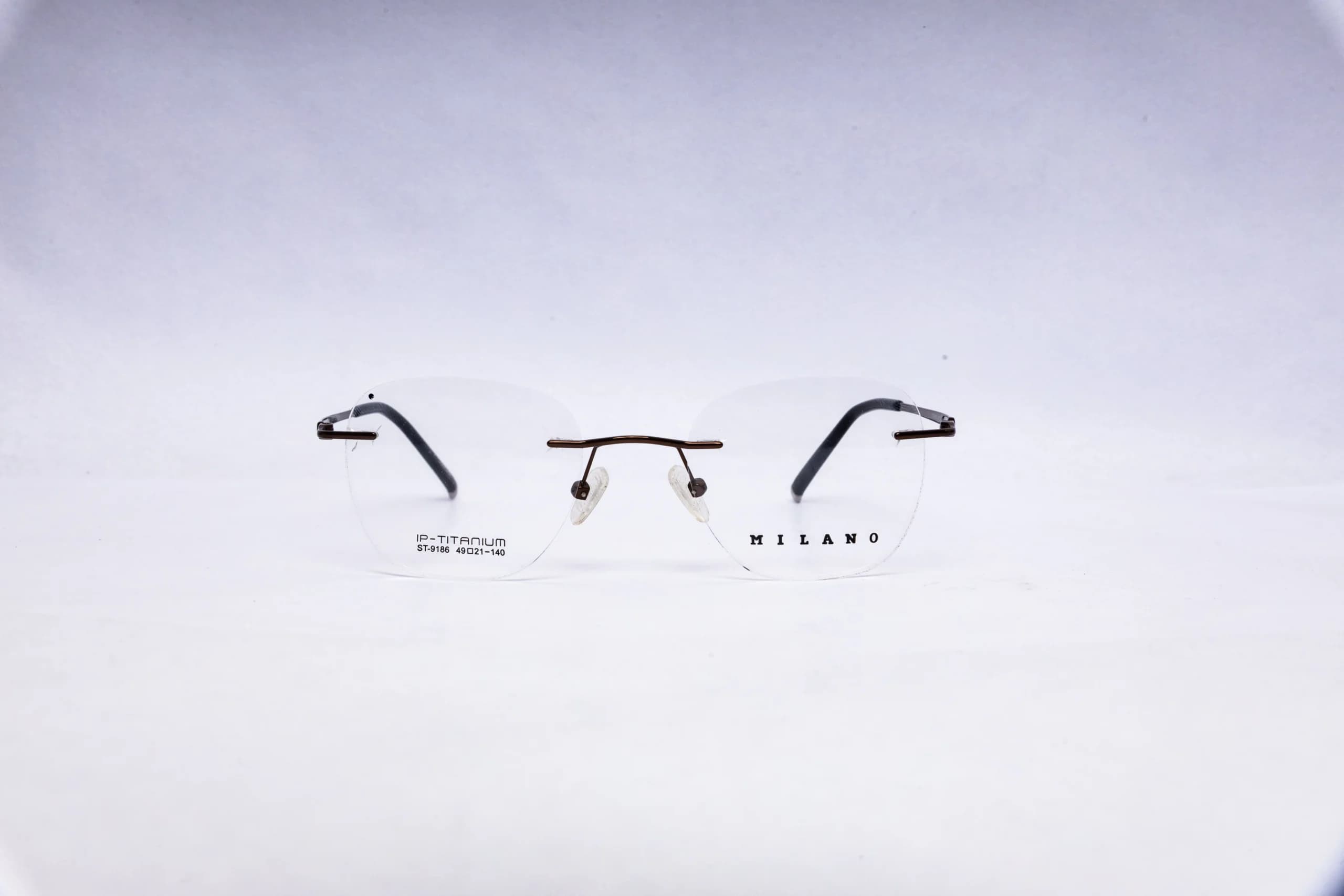 MILANO Rimless Round Silver Titanium Eyeglasses - front view
